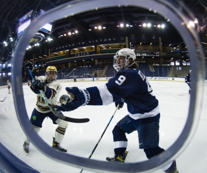 Mar 14, 2021; South Bend, Indiana, USA; Penn State's Alex Limoges (9) reaches out to grab a puck as Notre Dame s Jesse Lansdell (14) defends at the Compton Family Ice Arena. Mandatory Credit: Michael Caterina/South Bend Tribune-USA TODAY NETWORK