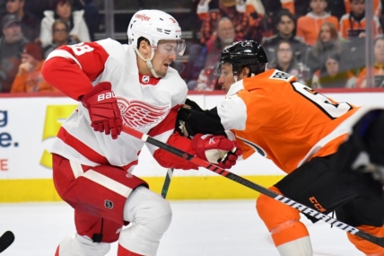Mar 5, 2023; Philadelphia, Pennsylvania, USA; Detroit Red Wings defenseman Robert Hagg (38) is checked by Philadelphia Flyers defenseman Justin Braun (61) during the first period at Wells Fargo Center. Mandatory Credit: Eric Hartline-USA TODAY Sports
