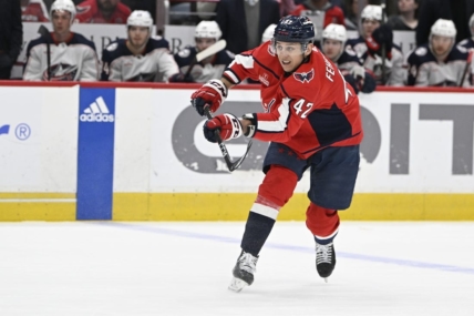 Mar 21, 2023; Washington, District of Columbia, USA; Washington Capitals defenseman Martin Fehervary (42) assists on a goal by Washington Capitals right wing T.J. Oshie (not shown) against the Columbus Blue Jackets during the first period at Capital One Arena. Mandatory Credit: Brad Mills-USA TODAY Sports