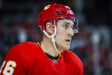 Apr 2, 2023; Calgary, Alberta, CAN; Calgary Flames defenseman Michael Stone (26) skates against the Anaheim Ducks during the third period at Scotiabank Saddledome. Mandatory Credit: Sergei Belski-USA TODAY Sports