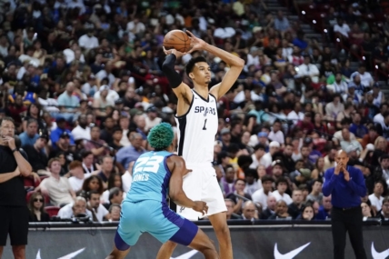 Jul 7, 2023; Las Vegas, NV, USA; San Antonio Spurs forward Victor Wembanyama (1) controls the ball against Charlotte Hornets forward/center Kai Jones (23) during the second half at Thomas & Mack Center. Mandatory Credit: Lucas Peltier-USA TODAY Sports